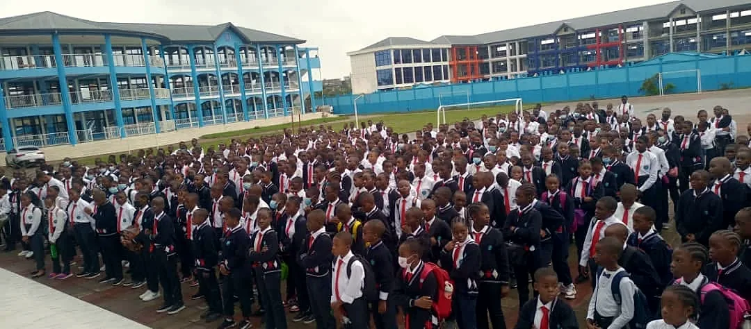 Students from the host school gathered in the schoolyard